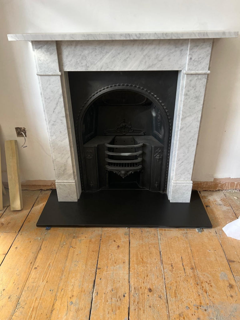 Classic Victorian era decorative Carrara marble fireplace.