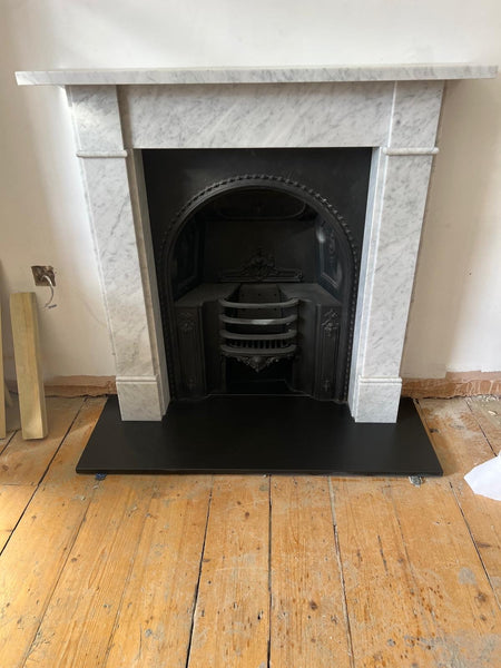 Classic Victorian era decorative Carrara marble fireplace.