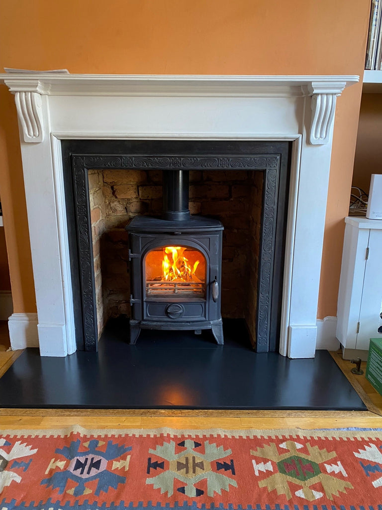 Fireplace inspiration - the traditional Sigma Eco stove complemented by MTM timber surround featuring corbels and decorative slips and headers