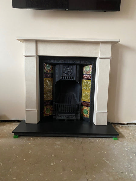 Tiled fireplace inspiration - original cast iron tiled insert with original fireplace tiles which complements the Corinthian Stone Hersham Surround