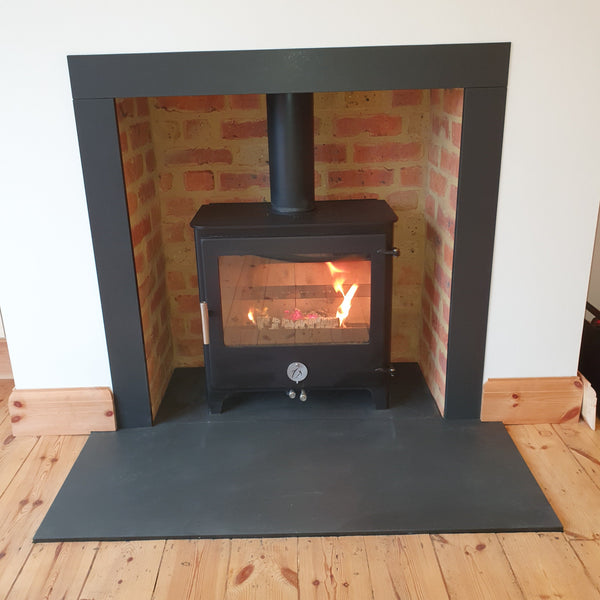Recently Installed Chilli Penguin Woody 5kW Cat Ecodesign featuring slips and headers with a slate hearth and cleaned brickwork chamber. 