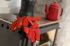 Chilli Penguin High & Mightly Tall Order  stove has a  large top plate which offers a wider surface for placing a kettle on, red oven gloves are included.