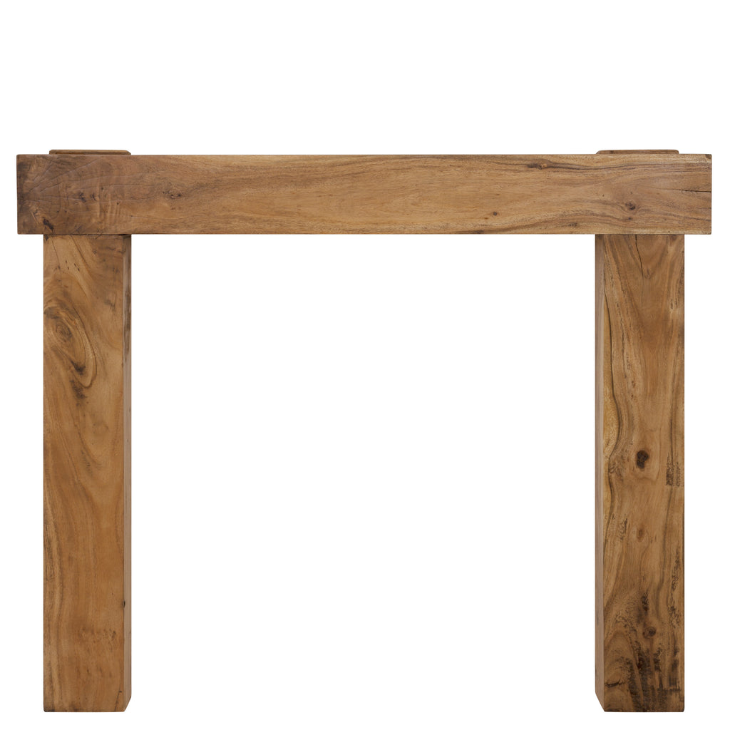 The New York wooden fireplace surround, crafted with precision and detail that see he shelf crosses in front of the legs and extends beyond their width, creating an impressive focal point