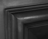Close up of the Royal cast iron fireplace insert's imposing, straight-edged detail, bold shape and square detailing,