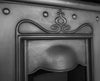 The Tulip Combination cast iron fireplace in the Art Nouveau style.  Featuring a classic tulip  design sits attractively between the canopy and the shelf.