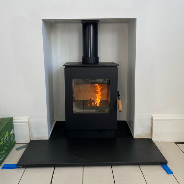 Experience the efficiency and style of the 4kW Wood Burning Ecodesign Stove - Burley Launde 9304-C. This installation features a cladded interior and slate hearths, this stove is a perfect blend of design and functionality.