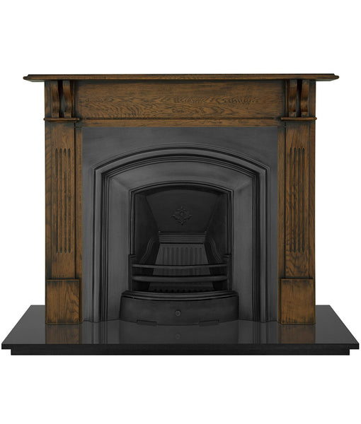 An Early Victorian  traditional black cast iron fireplace insert with an elegantly simple and wide half-arched opening.