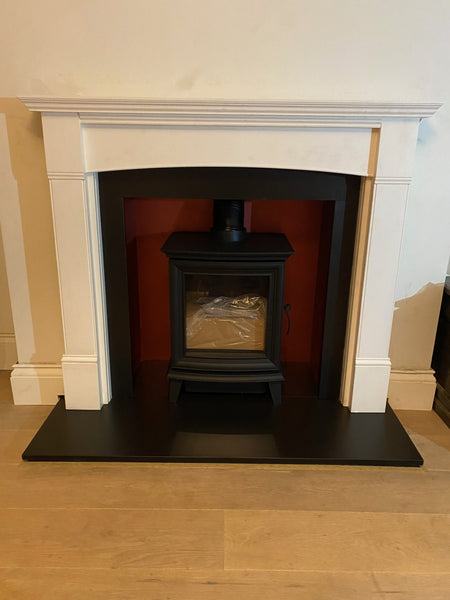 The GAZCO Chestefield 5 gas stove installed in a Shimmering Rose rendered chamber