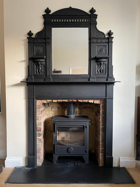 The overall aesthetic is a blend of a classic, ornate Victorian-style mantelpiece paried with&nbsp; contemporary, efficient ecodesign multi fuel stove