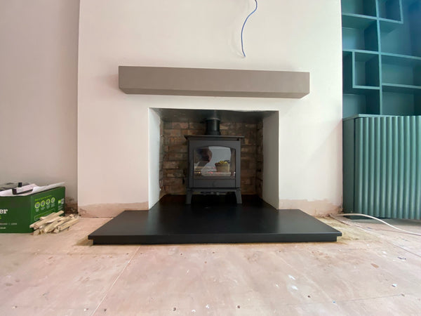 Recently installed ACR Earlswood III Eco Mulit Fuel Stove featuring Geocast Contemporary Stone 48