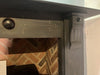 Close-up of Victorian Slate Surround with decorative design.