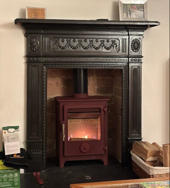 Recently installed the Dean Forge Mojave red Dartmoor 5 wood burning stove, which complements the customer's impressive decorative antique cast iron surround.