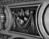 Close up showing decorative apples and urns designs of a Victorian full polish cast iron combination fireplace
