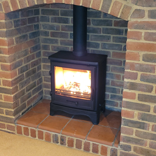 Recently Installed Bassington Eco Wood Burning Stove from Capital Fires in Black With Skirted Legs in original brickwork chamber. 