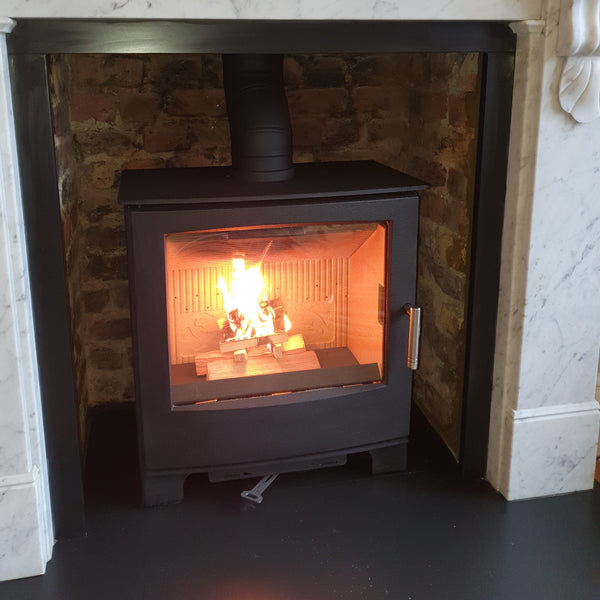 Mendip Woodland DC multi fuel stove featuring the cleaned brickwork