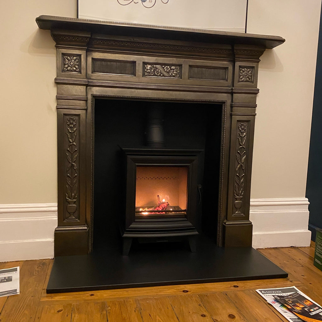 Recently Installed Stovax Chesterfield 5 multi-fuel Ecodesign stove featuring chamber boards painted black, original surround and slate hearths. 