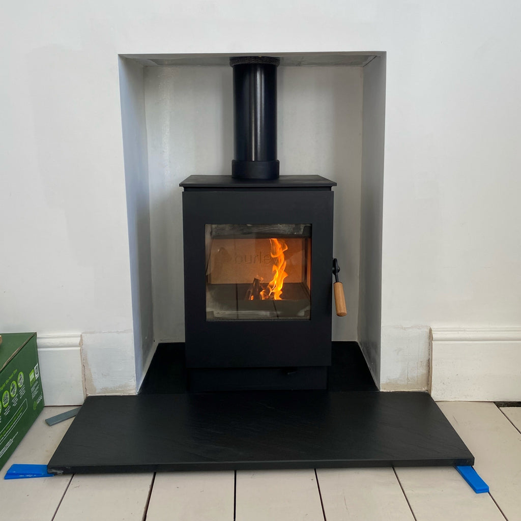 Recently installed Burley Launde 9304-C 4kW wood burning ecodesign stove featuring cladded interior, slate hearths. 